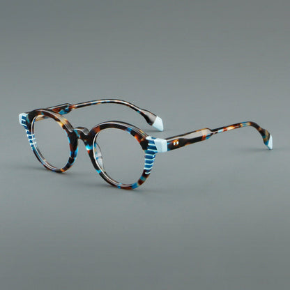
Monturas de gafas redondas decorativas de acetato con detalles a rayas en las esquinas y varillas esculpidas - Imagen 3