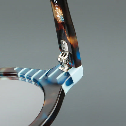
Monturas de gafas redondas decorativas de acetato con detalles a rayas en las esquinas y varillas esculpidas - Imagen 13