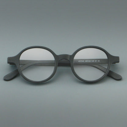 
Monturas de gafas redondas minimalistas de acetato, bordes completos lisos y líneas de patillas limpias