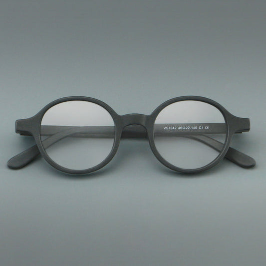 Monturas de gafas redondas minimalistas de acetato, bordes completos lisos y líneas de patillas limpias