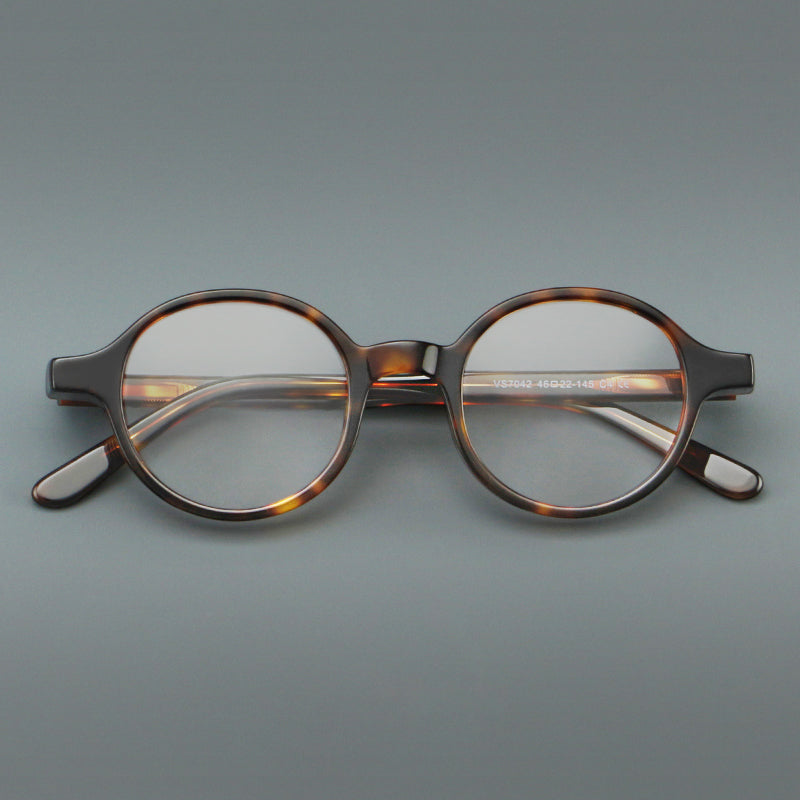 
Monturas de gafas redondas minimalistas de acetato, bordes completos lisos y líneas de patillas limpias - Carey