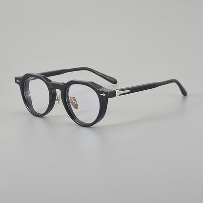 
Monturas de gafas redondas de acetato con esquinas superiores definidas y almohadillas nasales