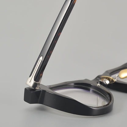 
Monturas de gafas redondas de acetato con esquinas superiores definidas y almohadillas nasales - Imagen 5