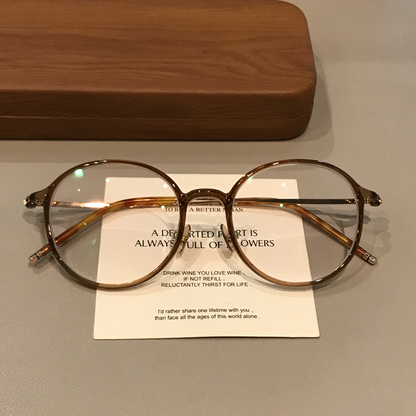 
Monturas de gafas redondas con a ros finos, gris transparente o marrón té frío - Imagen 2