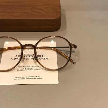 
Monturas de gafas redondas con a ros finos, gris transparente o marrón té frío - Imagen 3