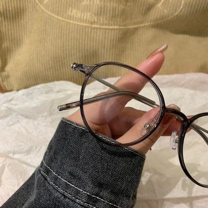 
Monturas de gafas redondas con a ros finos, gris transparente o marrón té frío - Imagen 5