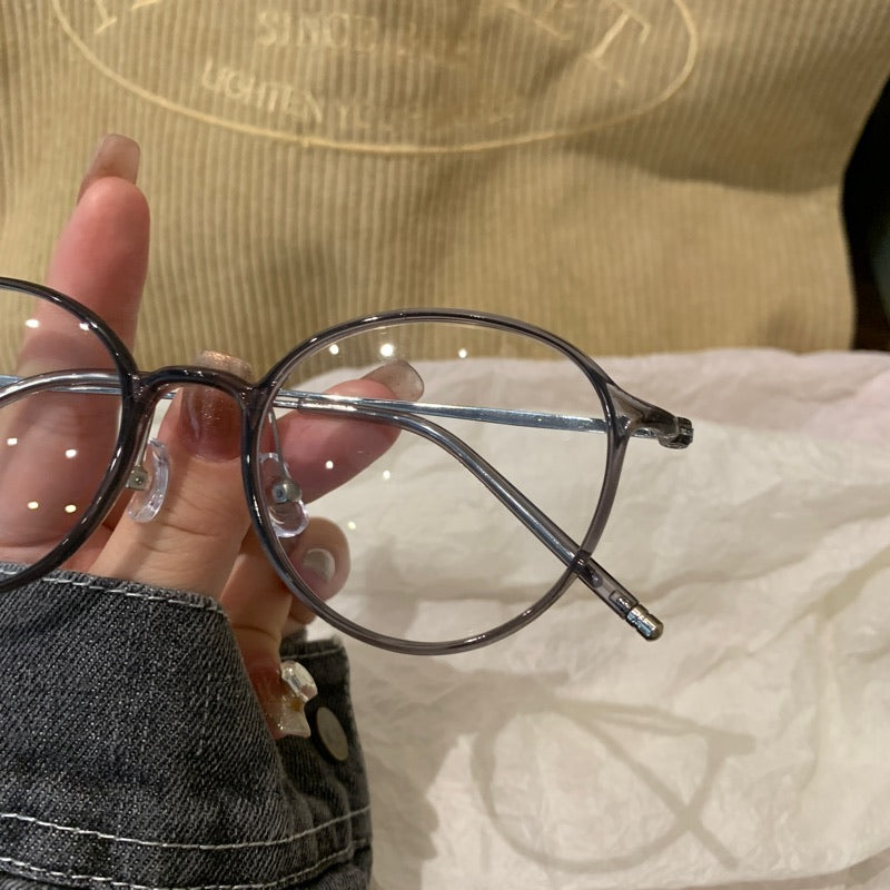 
Monturas de gafas redondas con a ros finos, gris transparente o marrón té frío
