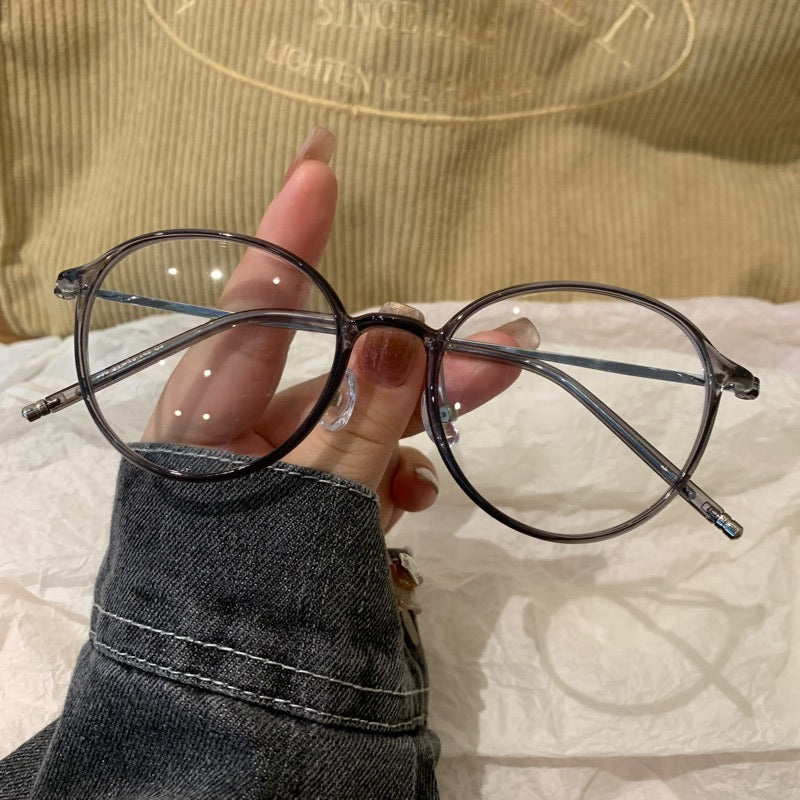 
Monturas de gafas redondas con a ros finos, gris transparente o marrón té frío