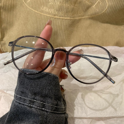 
Monturas de gafas redondas con a ros finos, gris transparente o marrón té frío