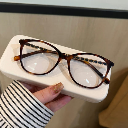 
Monturas de gafas ojo de gato con detalles de cadena en las varillas, en negro o carey - Imagen 8
