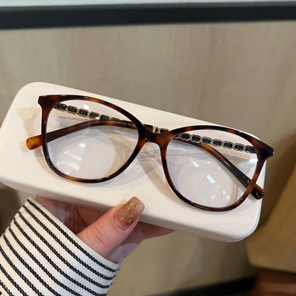 
Monturas de gafas ojo de gato con detalles de cadena en las varillas, en negro o carey - Imagen 10