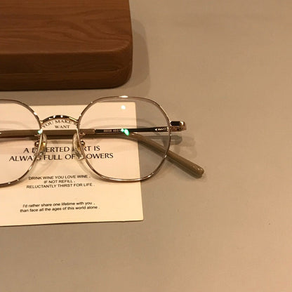
Monturas de gafas geométricas de estilo alambre con puente fino, tono dorado - Imagen 3