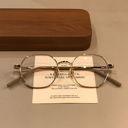
Monturas de gafas geométricas de estilo alambre con puente fino, tono dorado