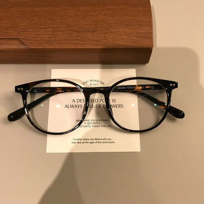 
Monturas de gafas redondas retro con puente de cerradura, en carey o negro