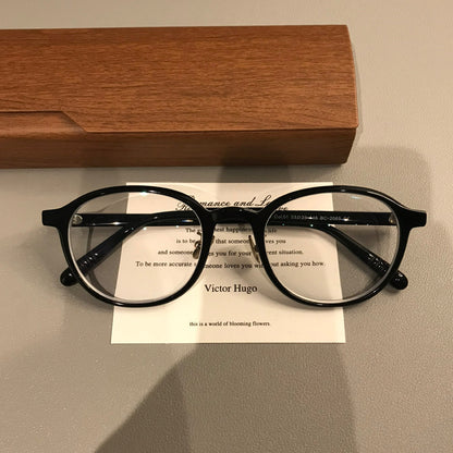 
Monturas de gafas ovaladas con borde superior grueso, negro, burdeos o carey