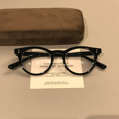 
Monturas de gafas ovaladas compactas con aros gruesos, negro o carey - Imagen 5