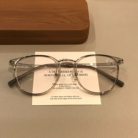 Monturas de gafas redondas con aros transparentes, gris coco