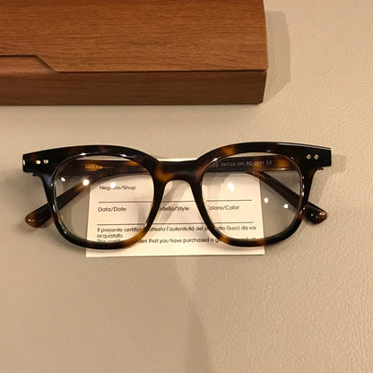 
Montura de gafas rectangular retro con remaches en las esquinas, carey