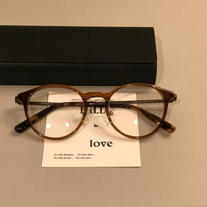 
Monturas de gafas redondas y compactas con varillas finas, en negro o carey - Imagen 4