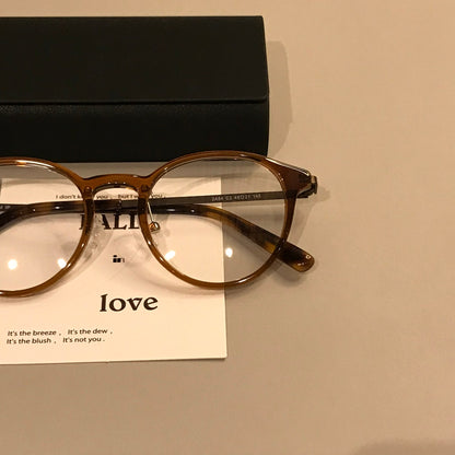 
Monturas de gafas redondas y compactas con varillas finas, en negro o carey - Imagen 5