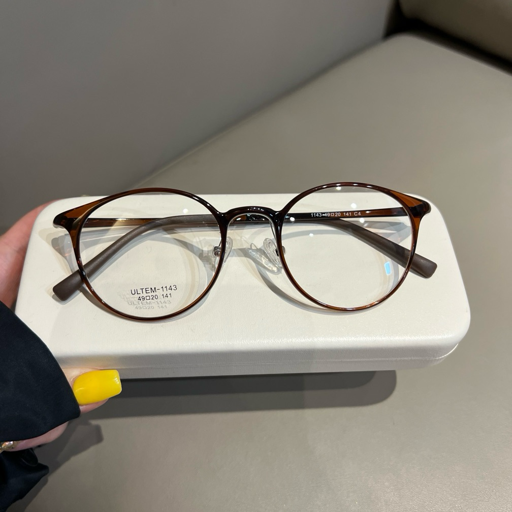 
Monturas de gafas redondas compactas con bordes finos, marrón castaño o negro