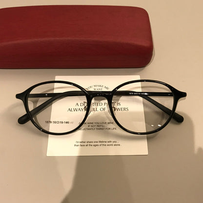 
Monturas de gafas redondas con varillas anchas y remaches en las esquinas, negro, carey o marrón caramelo