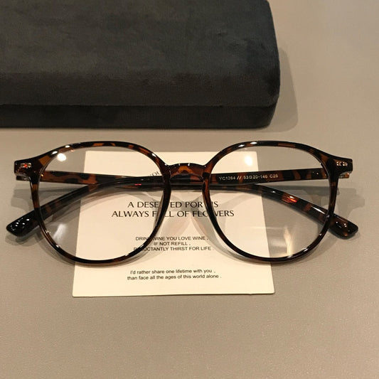 Monturas de gafas retro rectangulares redondeadas con aros gruesos, carey