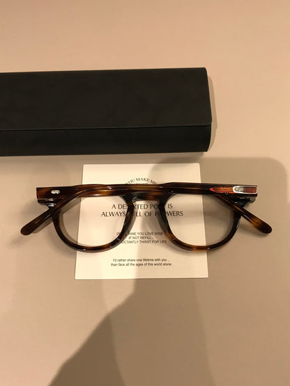 
Montura de gafas redonda retro con borde superior ancho, carey o negro brillante - Imagen 10