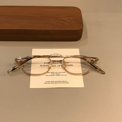 
Montura de gafas estilo alambre rectangular redondeada, tono dorado - Imagen 4