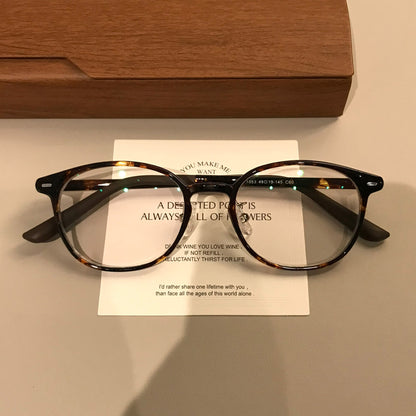 
Monturas de gafas retro compactas con frente cuadrado redondeado, en carey o negro